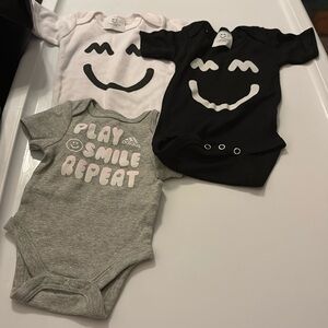 New 0-3 month assorted onesies